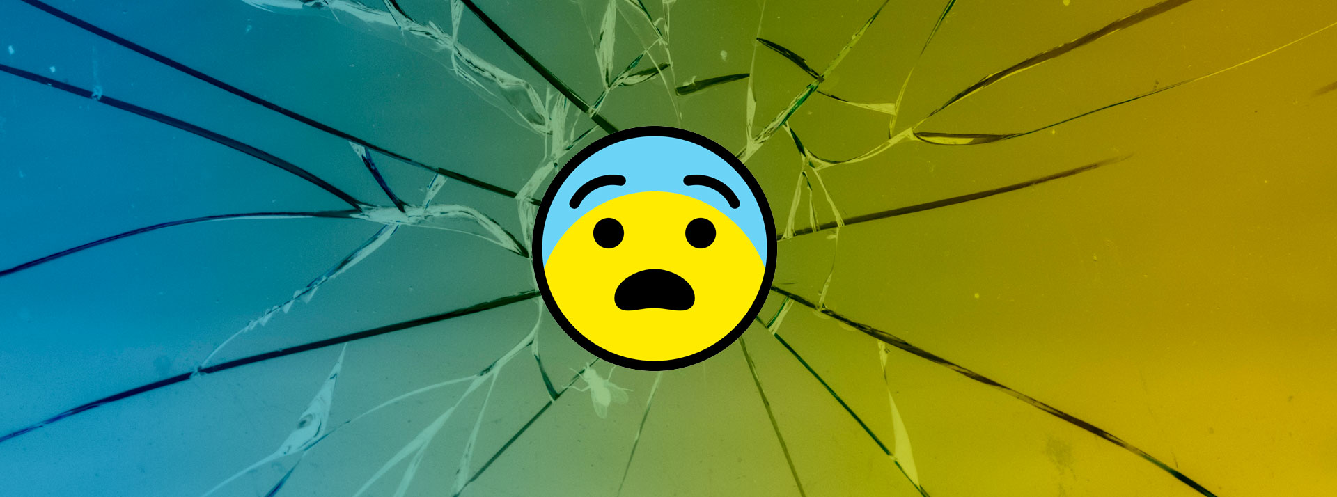 Emoji con cara de sorpresa sobre fondo de un vidrio roto.